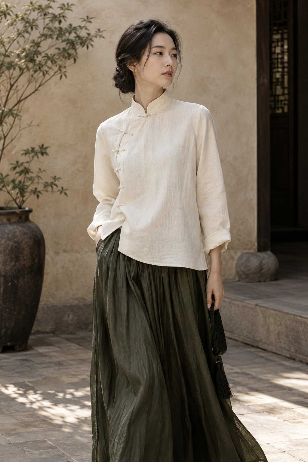Modern Chinese-inspired ivory blouse and flowing olive skirt